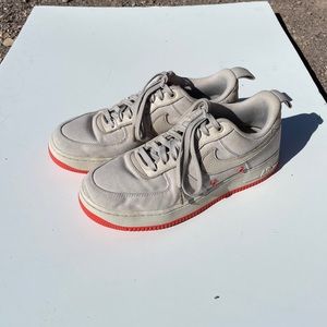 Tan Nike AF1s with orange soles